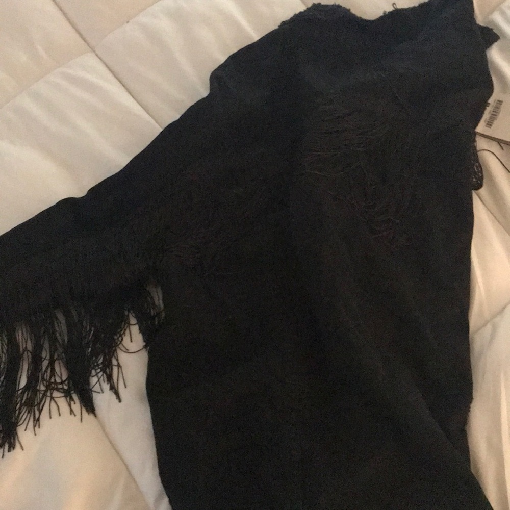 Black denim jacket with frills.